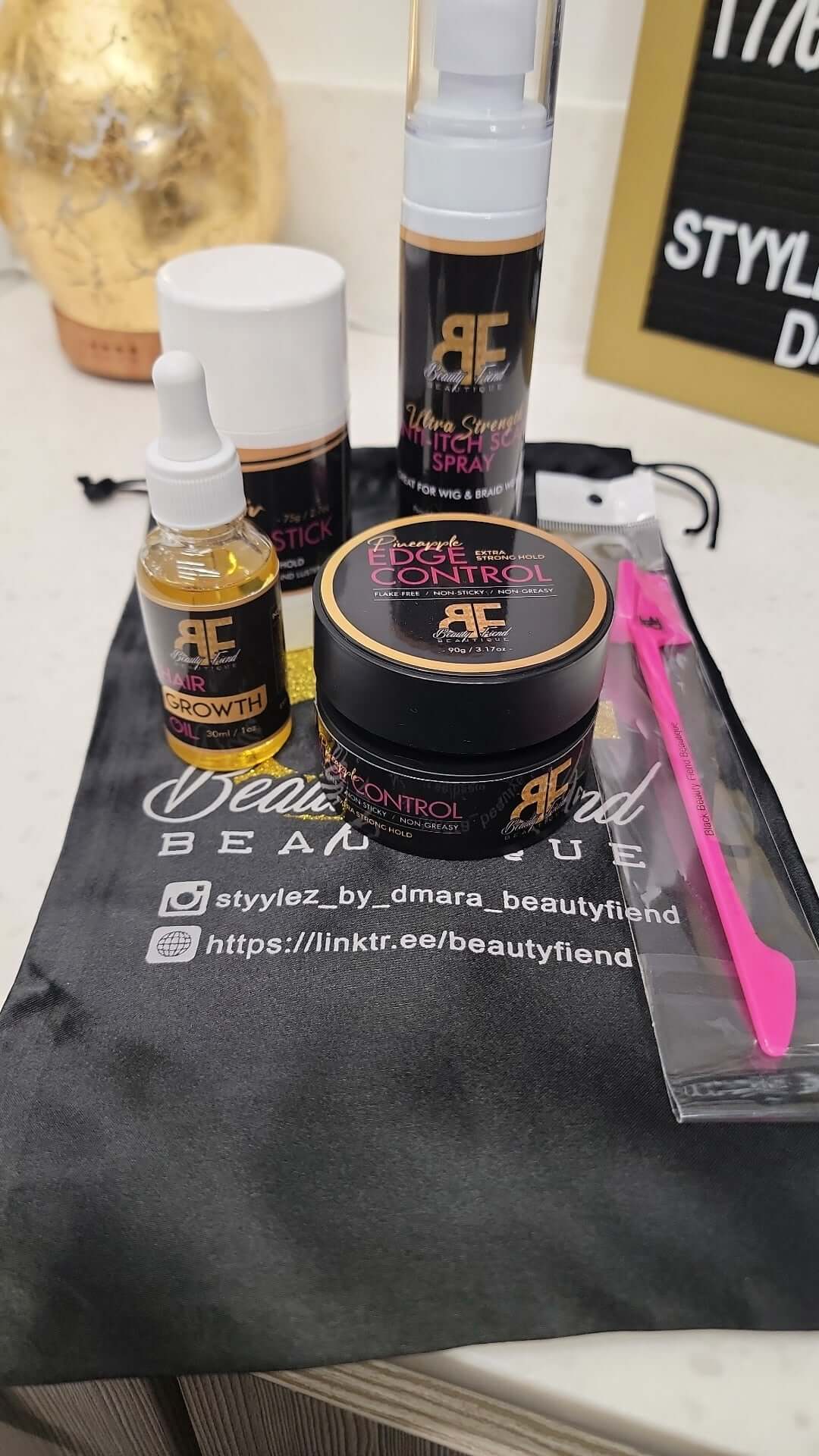 Image of Beauty Bag that includes Edge Control w/ Baby Hair 3n1 Comb, Wax stick, Hair growth Oil and Teatree Antiitch Spray